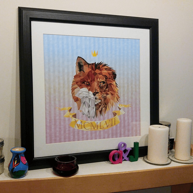 art print of geometric animal head framed and displayed on a mantle